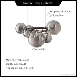 Chandelier with smoke grey glass shades and adjustable drop cord on a white background