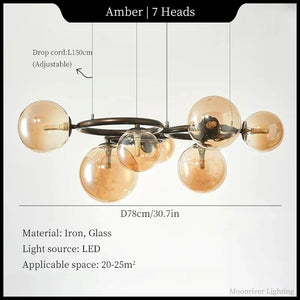 Chandelier with amber glass globes and metal frame on a white background