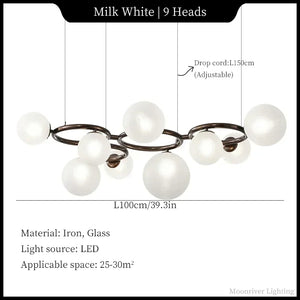 Chandelier with white spherical lights and adjustable drop cord, labeled with dimensions and material details.