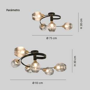 Two views of a modern multi-arm pendant light fixture with clear faceted glass globes and black curved arms with brass accents, shown with dimension labels: top view labeled 75 cm diameter and 30 cm height, bottom view labeled 93 cm diameter and 30 cm height, on a light gray background.