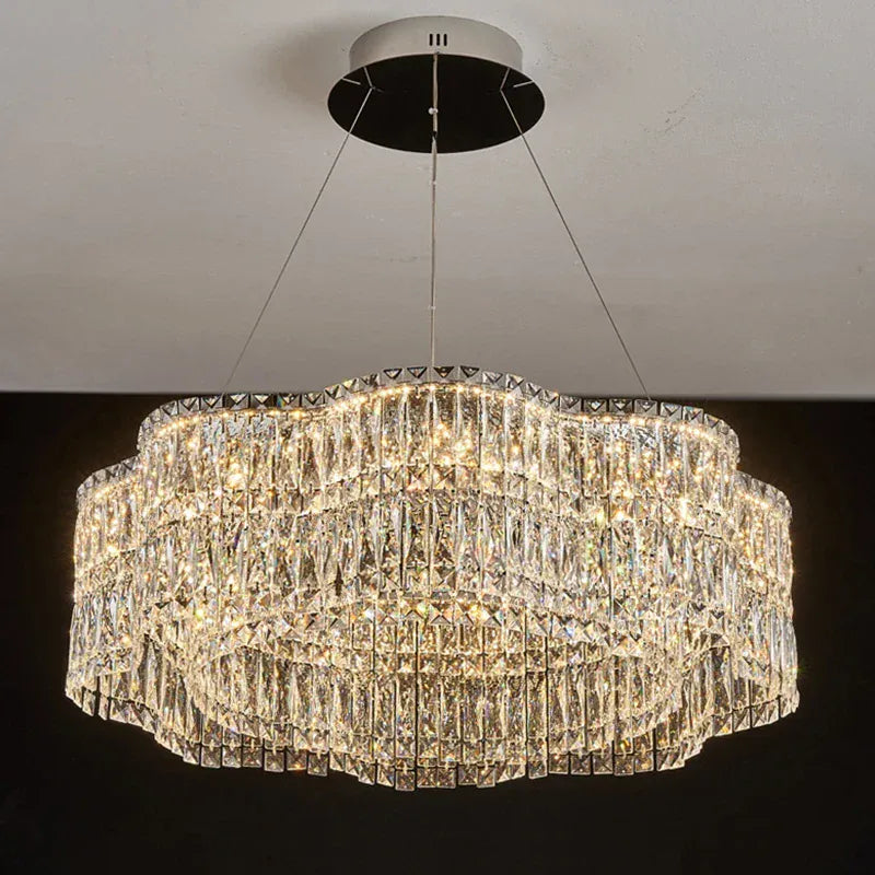 Crystal chandelier hanging from the ceiling with a dark background