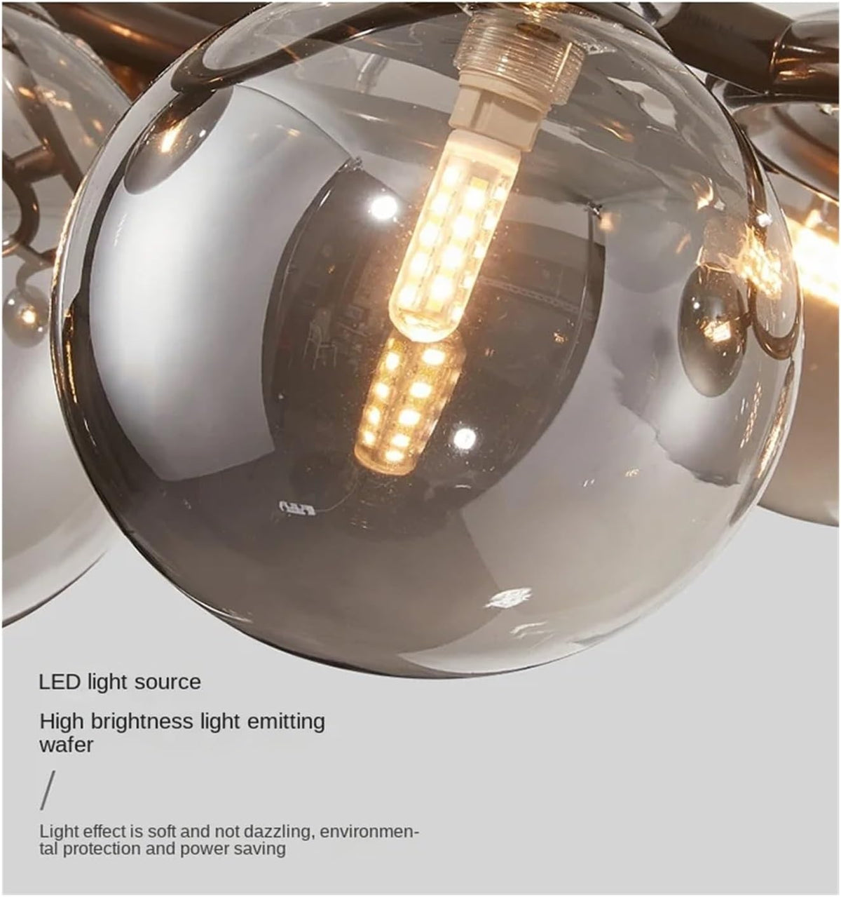 Close-up of a modern ceiling light fixture with reflective glass shades.