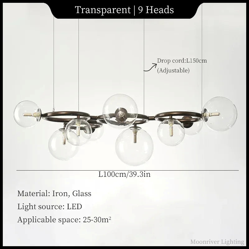 A 9-head transparent glass globe chandelier with an iron frame, shown with dimension labels, cord length, material info, and space requirements on a white background.
