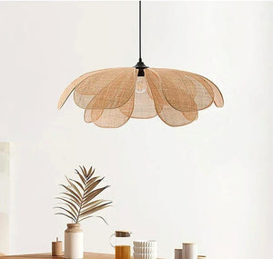 Woven pendant light fixture on a white background