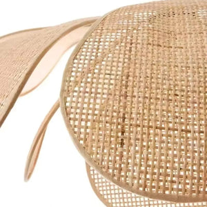 Close-up of a woven straw hat with a white background