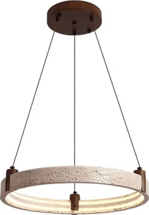 A modern circular pendant light with a textured beige stone or concrete ring, suspended by thin black cords from a dark brown circular ceiling canopy.
