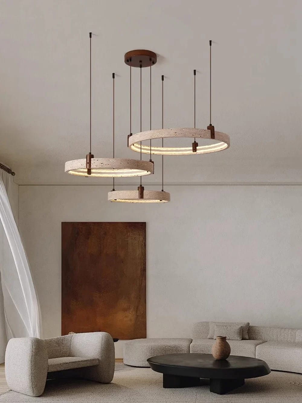 Modern living room with pendant lights, sofa, and coffee table.
