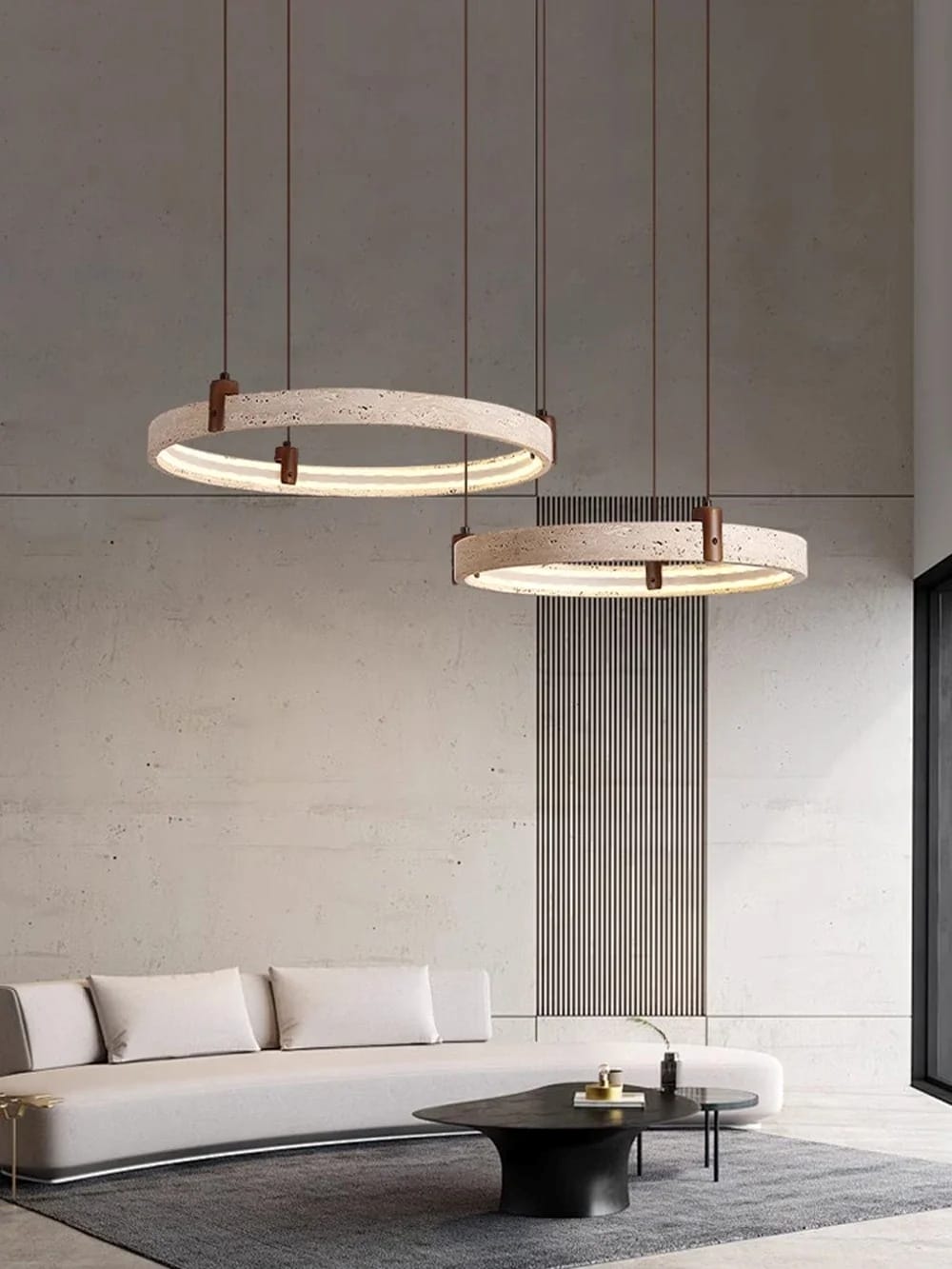 Modern living room with two pendant lights hanging above a sofa.