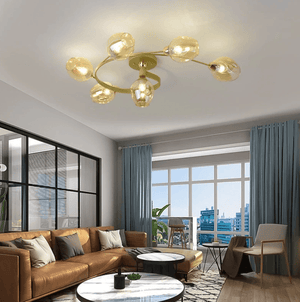 Modern living room with a ceiling light fixture, brown sofa, and large windows.