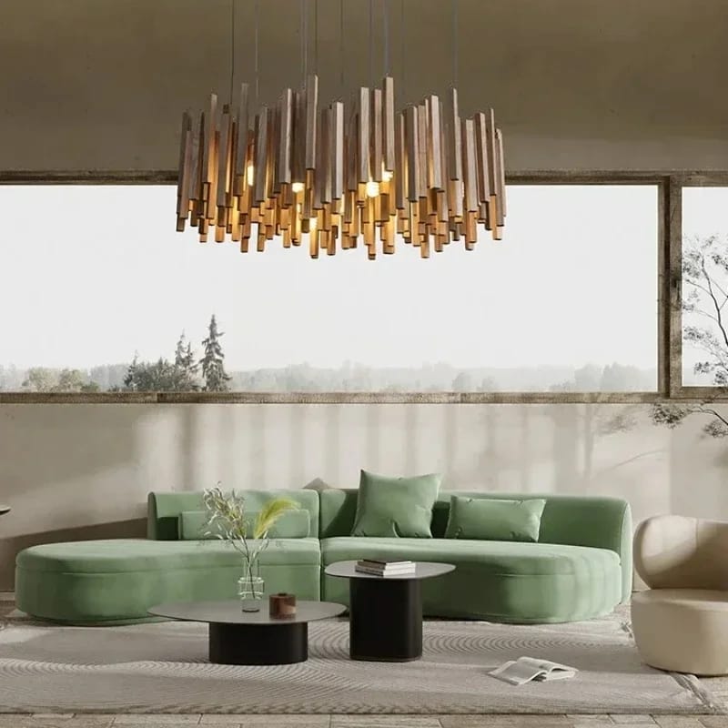 Modern living room with a green sofa, round coffee table, and decorative chandelier.